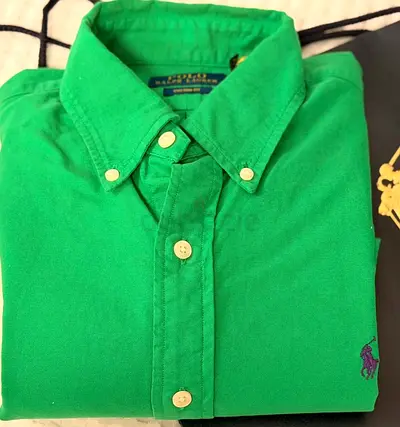 A green cotton button-down shirt from Polo Ralph Lauren, size M, custom- fit Oxford.