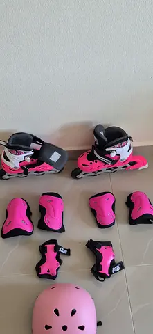 Kids pink adjustable inline skates with helmet and protective pads - size adjustable