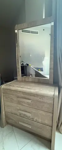 Three-drawer wooden dresser with attached mirror - light oak finish