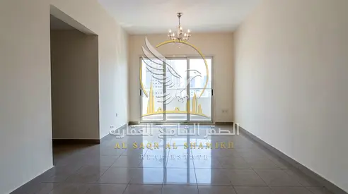 Two bedroom apartment with a living room for annual rent in Abu Shagara Sharjah with a balcony and open view
