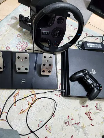 PlayStation 4 pro 1tb and Steering Wheel urgent for sale