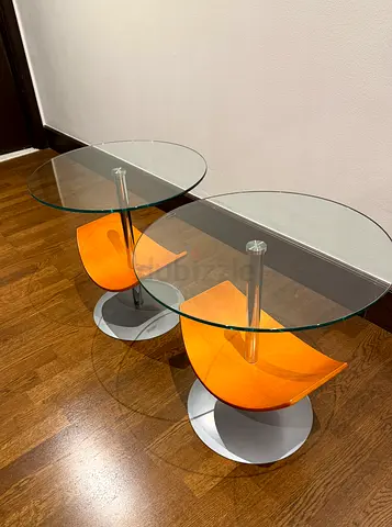 Pair of modern glass-top side tables with wooden shelf