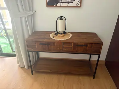 Wall-mounted wooden cabinet with shelves and drawers