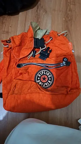 Kipling orange backpack/bag, spacious with multiple pockets, zippers and adjustable straps
