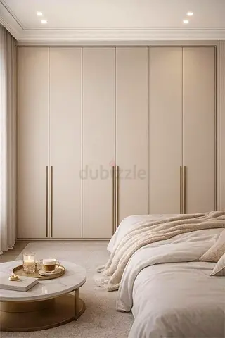 Built-in bedroom wardrobe with tall handles — beige modern design