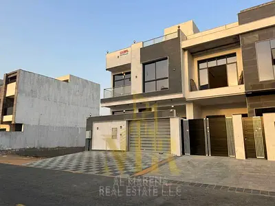 Villa for sale in Al Helio, Ajman | 4 master bedrooms + roof | Includes registration and ownership fees, electricity, water, and air conditioning. Fre