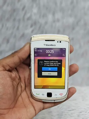 Vintage white BlackBerry Torch smartphone Sliding
