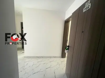 2BR + Living Room for annual rent in Al Alia, Ajman. Brand-new building, first tenant, 3 bathrooms,
