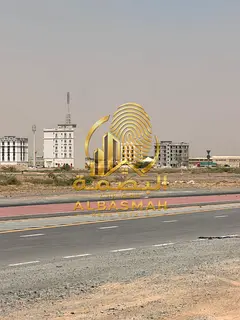Commercial land for sale in Sharjah, Al Malha area, on a 36-meter paved street. Ownership available 