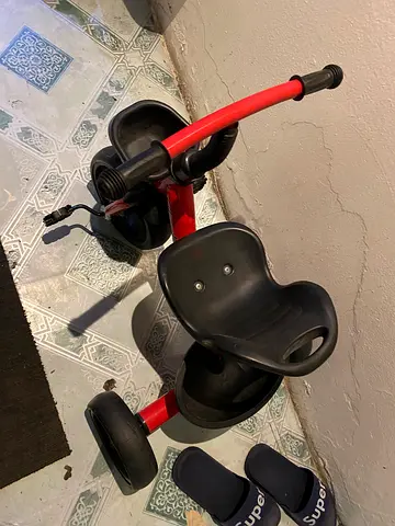 Red toddler tricycle with backrest - good used condition