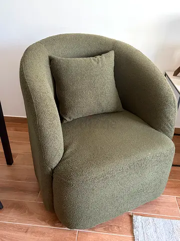 Comfortable dark-green boucle accent armchair with cushion