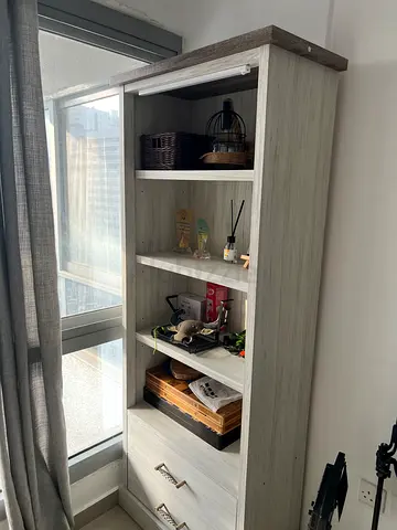 Tall wooden bookshelf with drawers - light grey finish