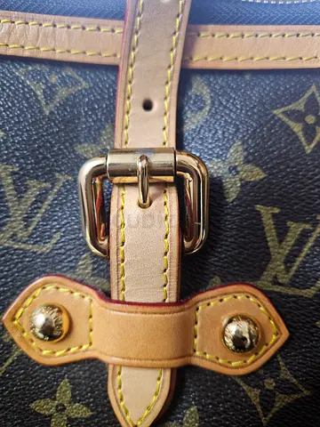 Pre-owned designer monogram shoulder bag with leather straps
