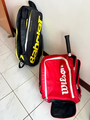 One Babolat and one Wilson tennis bag