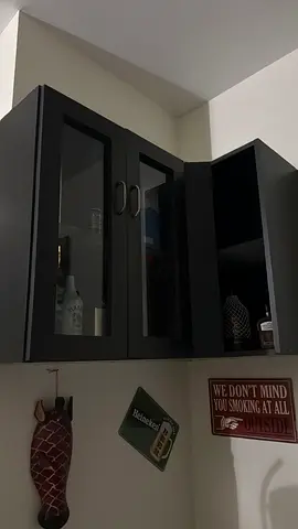 Black glass-front cabinet / display cupboard - good condition with lighting