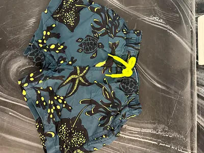 Boys swim shorts blue floral, size age 4