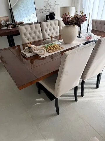Solid wood dining table with 6 upholstered chairs - like new