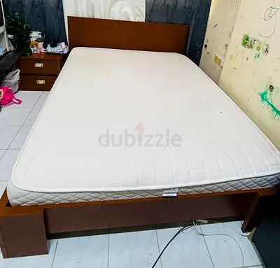 Queen wooden bed frame with mattress - used, good condition. One drawer and sofa bed free