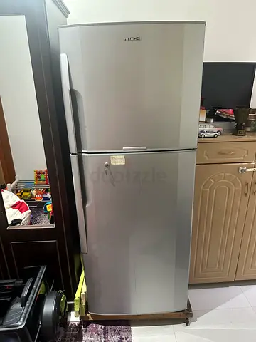 Silver double-door refrigerator with top freezer (LOW cooling)