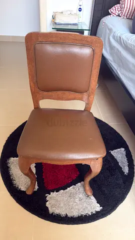 Wooden  chair with brown faux leather seat