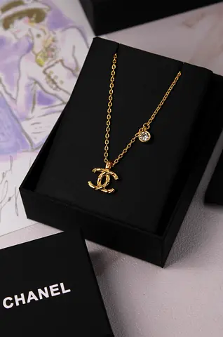 Chanel gold-tone CC logo pendant necklace with crystal charm