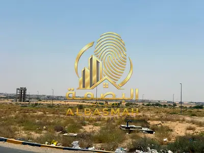 Corner commercial land for sale in Sharjah, Al-Ruqaiba Al-Sayouh area (Al-Tai Commercial), freehold ownership for Arabs