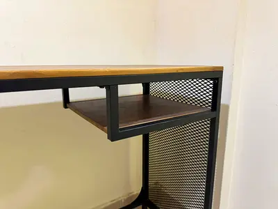 Industrial-style study table with metal frame and wooden top