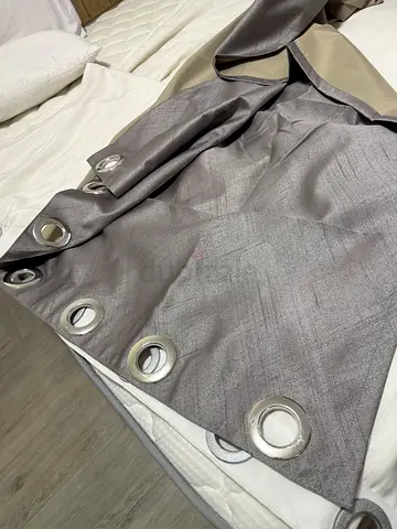 Multiple blackout curtains with metal eyelets