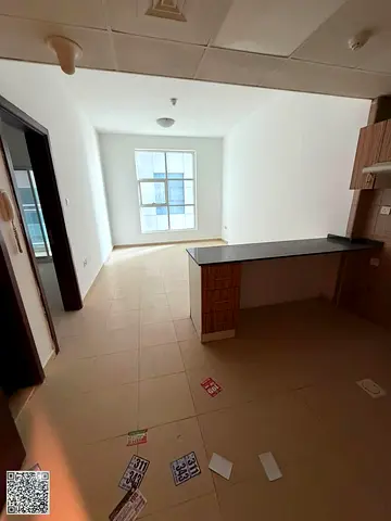 One-bedroom apartment with a living room, gym, swimming pool, kids' area, free parking, two bathrooms, and a balcony, at a special price.