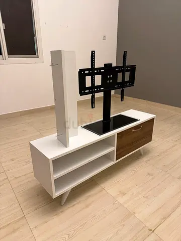 Modern white TV stand with swivel mount and storage cabinet it’s in good condition all together