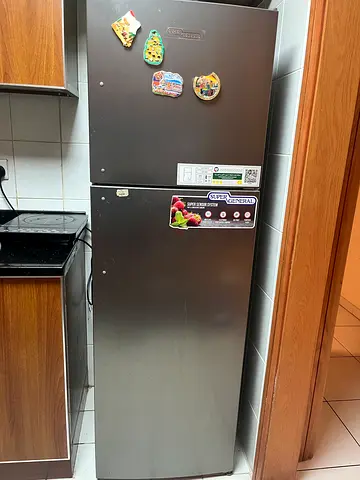 Used single-door refrigerator in good condition - stainless finish