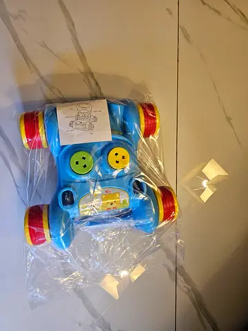 Used colorful plastic baby push car toy - lightweight ride-on/roller
