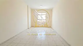 Two bed and Hall in Al Majra Sharjah Central AC Open View Free Maintenance Sandy Parking Available N