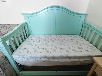 Mint green wooden daybed/crib convertible with 2 mattress (excellent condition)one matress brand new