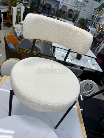 Modern boucle dining/side chair with curved back — cream