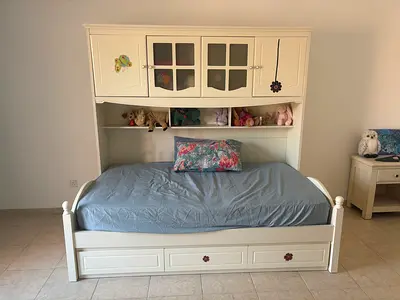 White wooden single bed (120cm wide) with overhead storage and 3 pull-out drawers