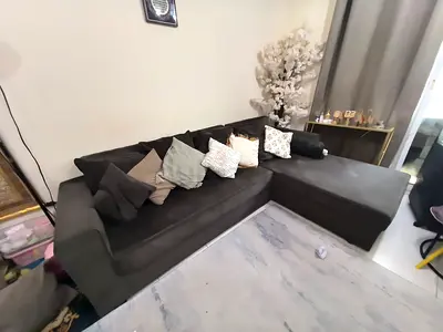 Large L-shaped dark grey fabric sectional sofa – good condition