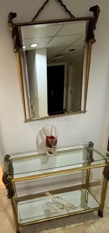 Vintage glass two-tier console table and wall mirror