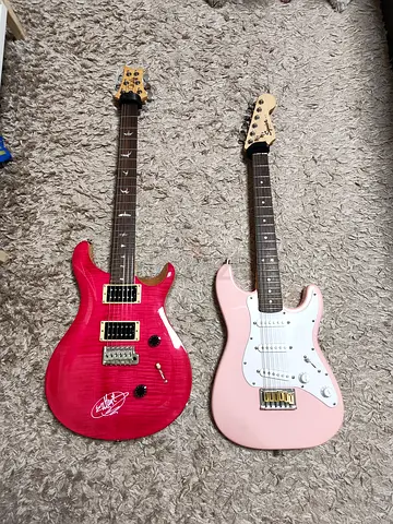 PRS Custom 24 SE and pink Squire Mini Strat-style.