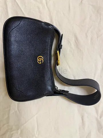 Black Gucci leather shoulder bag with GG logo