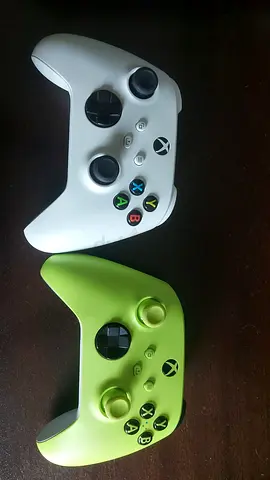 Two Xbox One wireless controllers - white and green, good condition
