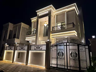 For sale in Al Helio 1: A two-story villa with a roof terrace, featuring 6 master bedrooms, a majlis, a living area, and a maid's room.