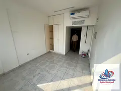 A very spacious studio apartment featuring a separate kitchen, a built-in wall wardrobe, central air