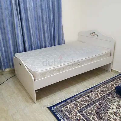Single White Wooden Bed with Floral Headboard Detail