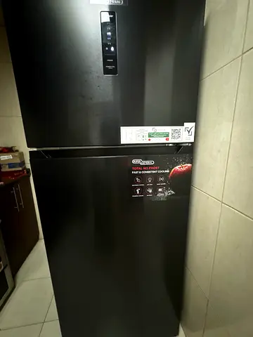 Black double-door refrigerator - good working condition