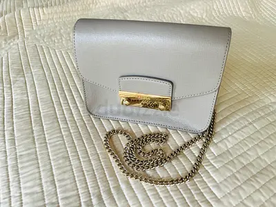 Furla clutch with hardware