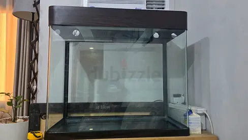 200L Curved Front Aquarium with Heater, Light & Decorations. - Size: 30" L × 15" W × 27.5" H.