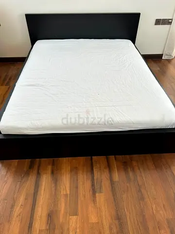 Queen-size black wood platform bed frame with headboard