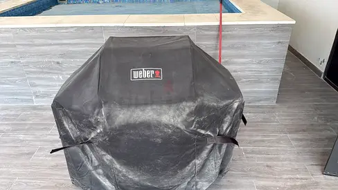 Weber gas BBQ with protective cover (used)