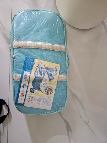 Light blue musical Moses basket with mattress - unused